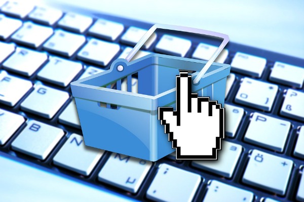 online shopping cart logo overlayed on keyboard