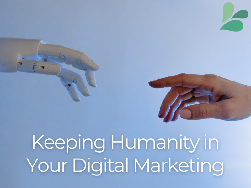 robot hand reaching toward a human hand with text overlay of keeping humanity in your digital marketing